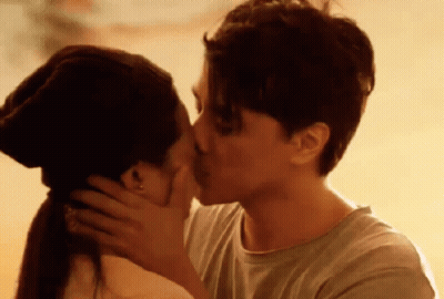 Man And Woman Kissing At Sunset GIF