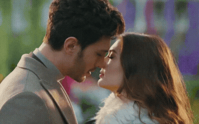 Man And Woman Kissing GIF