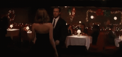 Man And Woman Kissing In Bar GIF