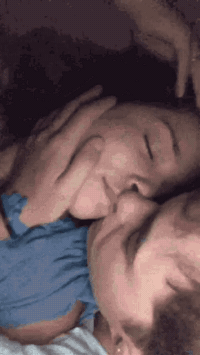 Man And Woman Kissing In Bed GIF