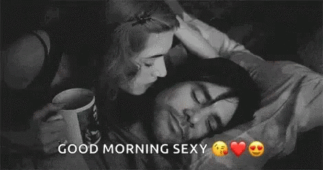 Man And Woman Kissing In Bed GIF
