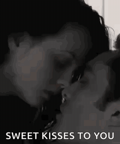 Man And Woman Kissing In Black And White GIF