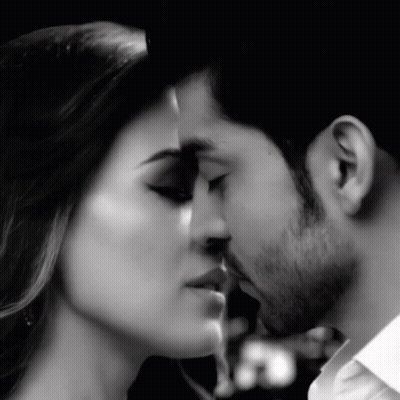 Man And Woman Kissing In Black And White Photo GIF