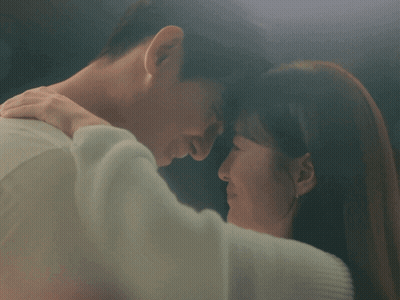 Man And Woman Kissing In Blurry Photo GIF