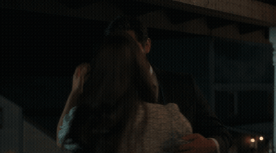 Man and Woman Kissing in Dark
