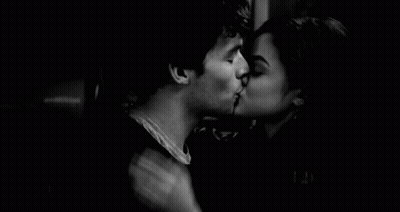 Man And Woman Kissing In Dark Room GIF