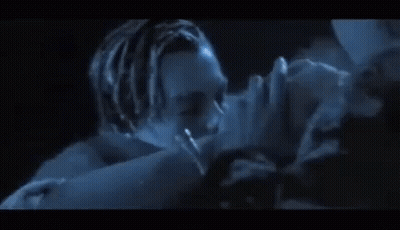 Man And Woman Kissing In Dark Room GIF