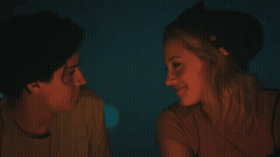 Man And Woman Kissing In Dark Room GIF