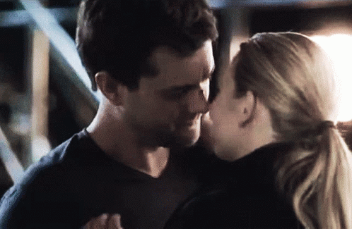 Man And Woman Kissing In Dark Room GIF