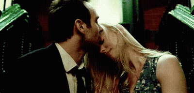 Man And Woman Kissing In Dark Room GIF