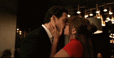 Man And Woman Kissing In Dark Room GIF