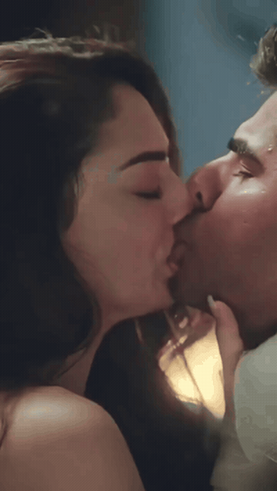 Man And Woman Kissing In Dark Room GIF