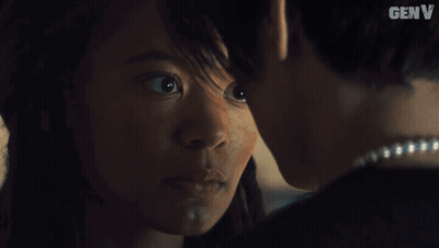 Man And Woman Kissing In Dark Room With Word Genv GIF