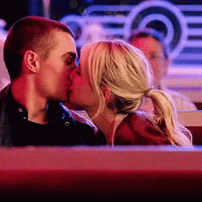 Man And Woman Kissing In Diner GIF