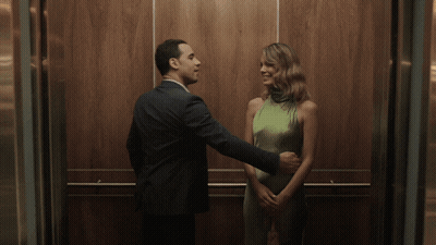 Man And Woman Kissing In Elevator GIF