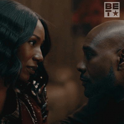Man and Woman Kissing in Front of Bet Logo