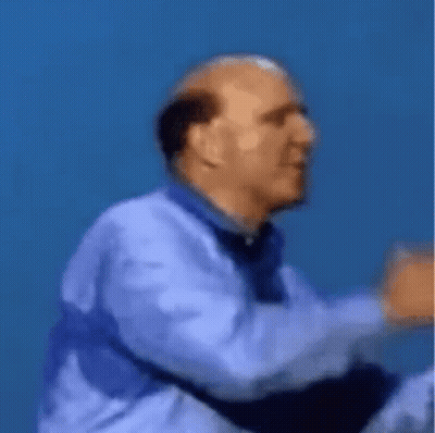 Man And Woman Kissing In Front Of Bush GIF