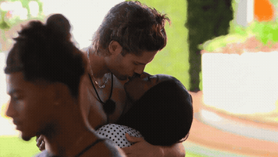 Man And Woman Kissing In Front Of Crowd GIF