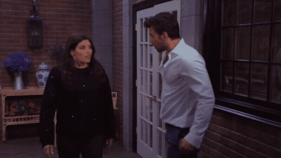 Man And Woman Kissing In Front Of Door GIF