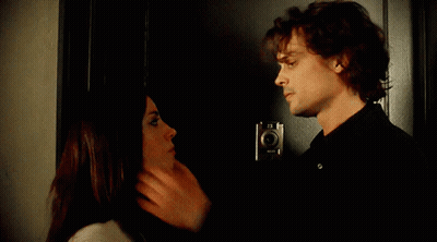Man And Woman Kissing In Front Of Door GIF