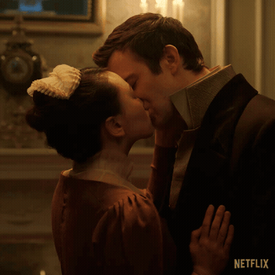 Man And Woman Kissing In Front Of Netflix Logo GIF