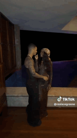 Man And Woman Kissing In Front Of Pool GIF