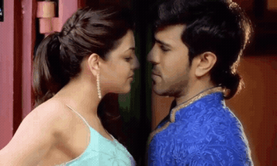 Man And Woman Kissing In Front Of Red Door GIF
