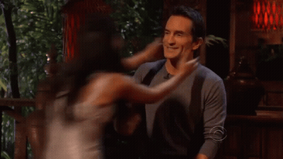 Man And Woman Kissing In Front Of Sign Saying C GIF
