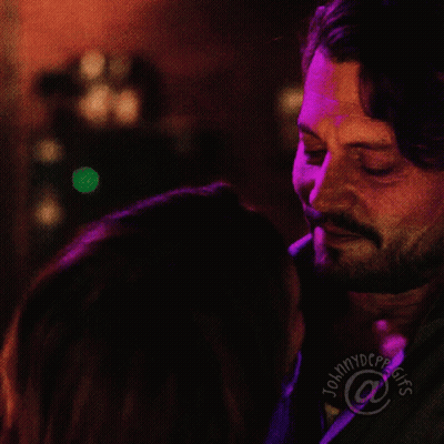 Man And Woman Kissing In Front Of Tommydcpp GIF
