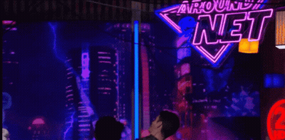 Man And Woman Kissing In Front Of US Army Sign GIF