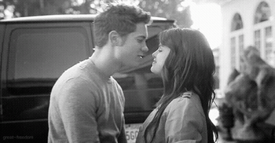 Man And Woman Kissing In Front Of Van GIF