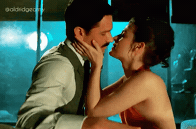 Man And Woman Kissing In Front Of Window GIF