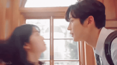 Man And Woman Kissing In Front Of Window GIF