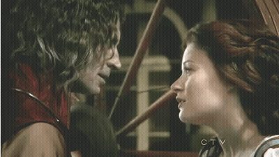 Man And Woman Kissing In Front Of Window GIF