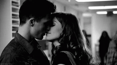 Man And Woman Kissing In Hallway GIF