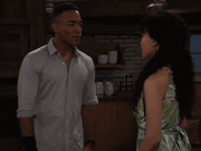 Man And Woman Kissing In Kitchen GIF