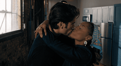 Man And Woman Kissing In Kitchen GIF
