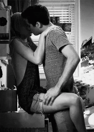 Man And Woman Kissing In Kitchen GIF