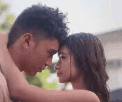 Man And Woman Kissing In Rain GIF