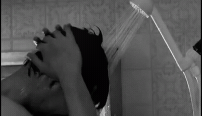 Man And Woman Kissing In Rain GIF