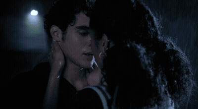 Man And Woman Kissing In Rain At Night GIF