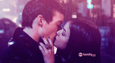Man And Woman Kissing In Rain GIF