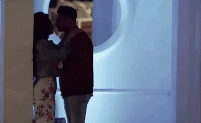 Man And Woman Kissing In Room GIF