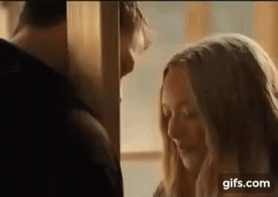 Man And Woman Kissing In Room GIF