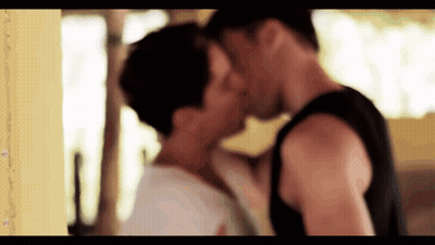Man And Woman Kissing In Room GIF