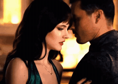 Man And Woman Kissing In Room GIF