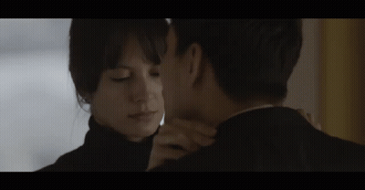 Man And Woman Kissing In Room GIF
