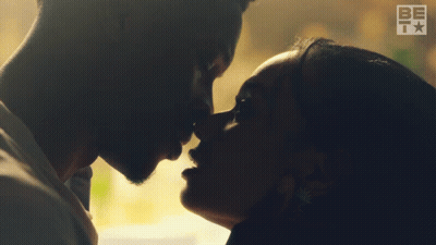 Man And Woman Kissing In Room GIF