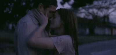 Man And Woman Kissing In The Dark GIF