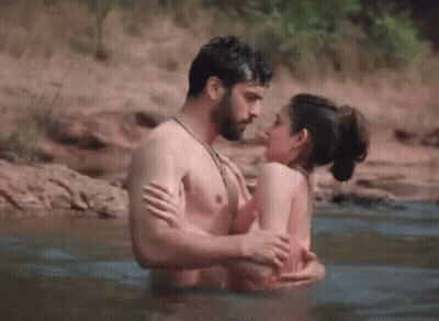 Man and Woman Kissing in Water